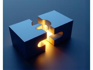 Silhouette of two business people shaking hands, symbolizing an acquisition